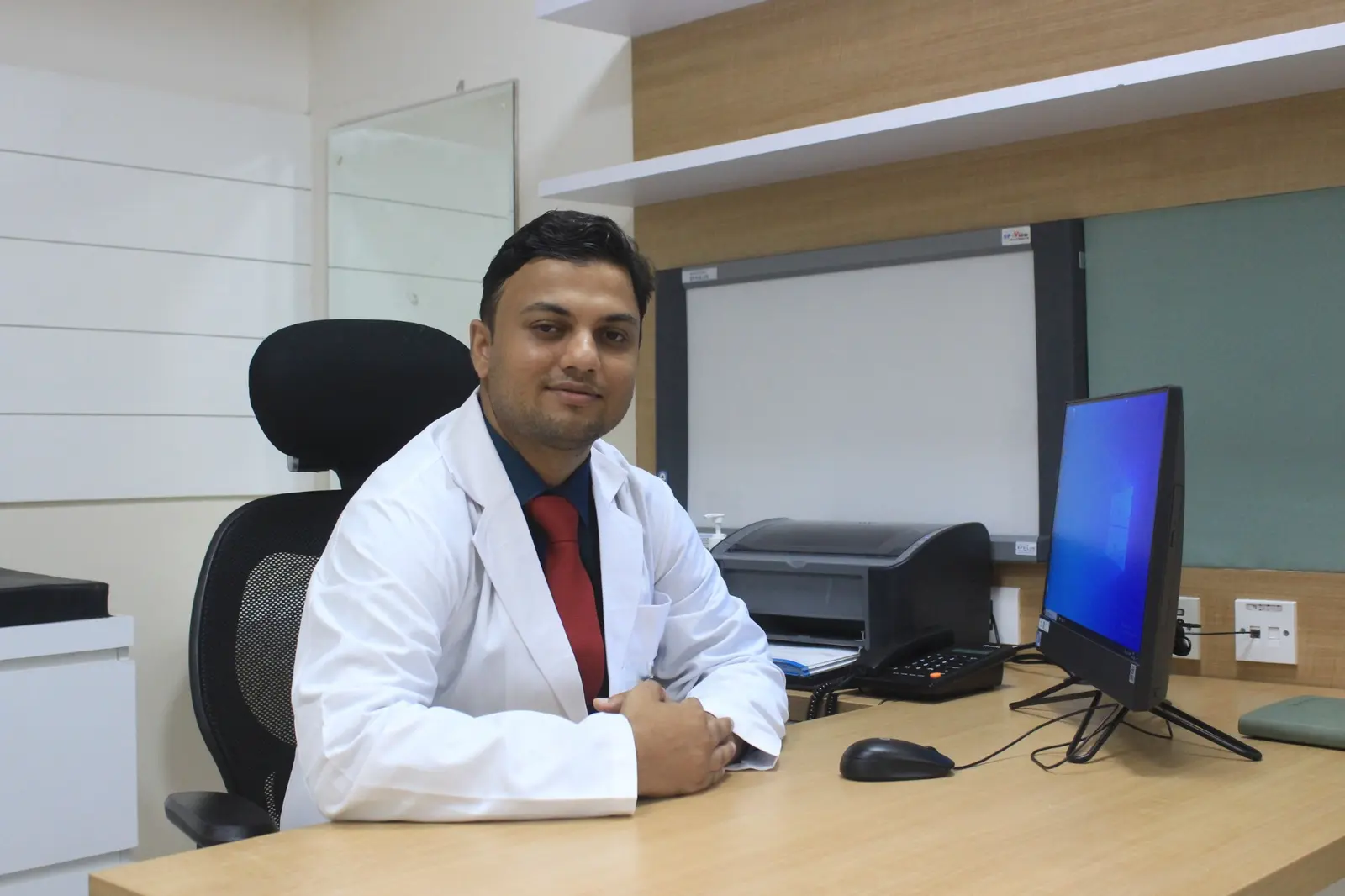 Dr. Himanshu Sharma seated in his endocrinology consultation room